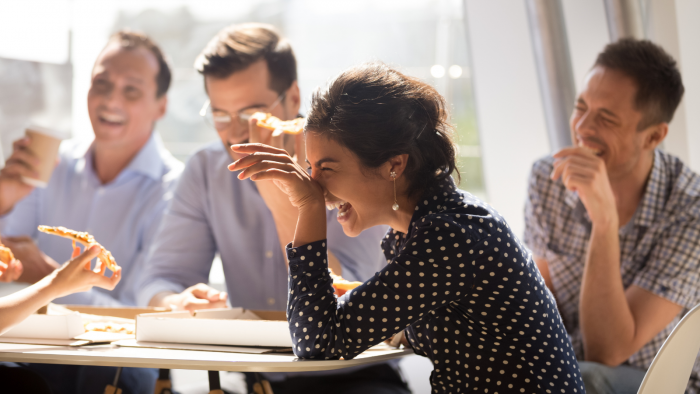 People laughing in a work meeting
